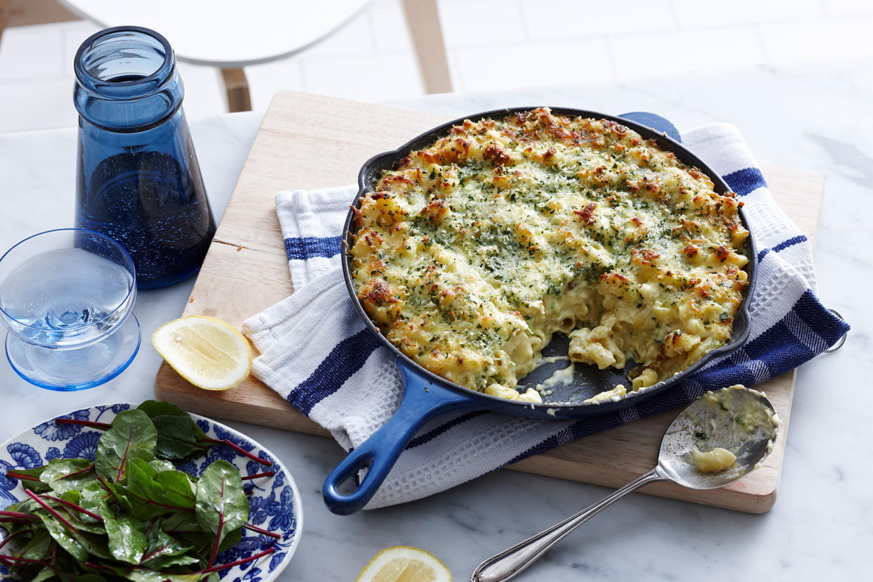 Meal with pan of macaroni cheese and salad leaf Getty Images/BRETT STEVENS