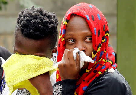 FILE PHOTO: Relatives of a person killed in an attack on an upscale hotel compound grieve in Nairobi, Kenya January 16, 2019. REUTERS/Njeri Mwangi/File Photo