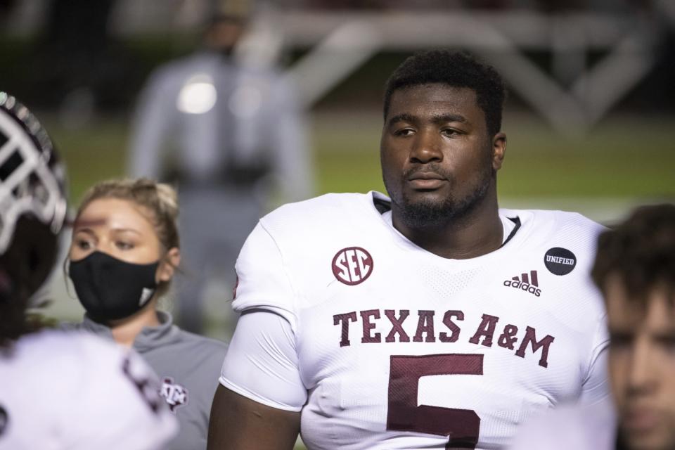 Texas A&M defensive lineman Bobby Brown III walks across the field before a game in November.