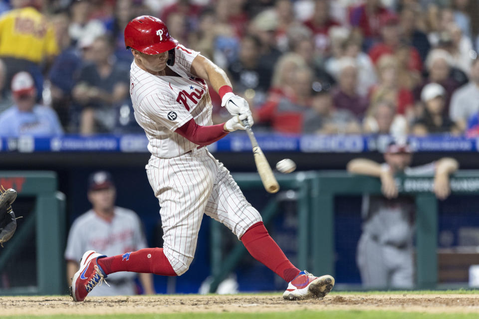 Philadelphia Phillies' Rhys Hoskins hits a three-run homer during the sixth inning of a baseball game against the Washington Nationals, Monday, July 26, 2021, in Philadelphia. (AP Photo/Laurence Kesterson)