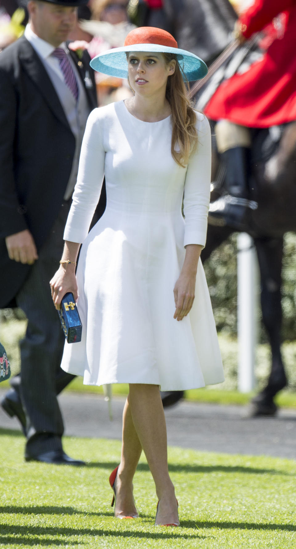 <p>An understated look is always going to be a hit, as Beatrice proved in this simple white dress and coloured hat combo at Ascot in 2015. <em>[Photo: Getty]</em> </p>