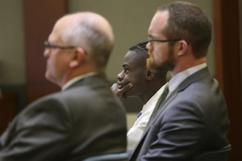 Weslie Martin, center, accused of burglarizing Wayne Newton's home, listens during his court hearing at the Regional Justice Center in Las Vegas, Tuesday, June 18, 2019. (Erik Verduzco/Las Vegas Review-Journal via AP)