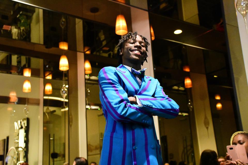 Deangelo Lee takes part in the Fash Up 2022 fashion show, a fundraiser to buy prom tickets for Milwaukee high school students.