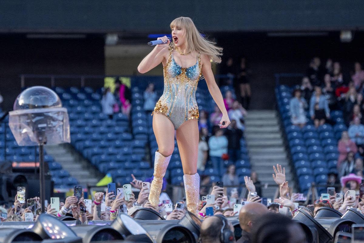 Taylor Swift performing on stage during her Eras Tour at Murrayfield Stadium <i>(Image: Getty)</i>