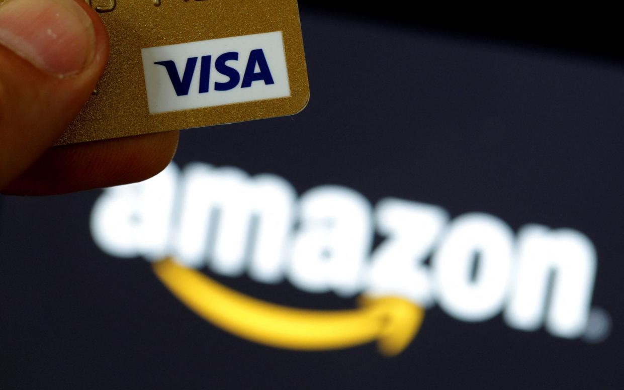 amazion visa credit cards ban backs down - PHILIPPE WOJAZER/ REUTERS