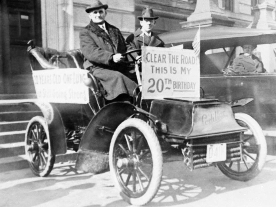 Mayor Charles F. Sullivan of Worcester, Massachusetts, drives a one-cylinder Cadillac on his birthday in 1923.