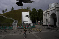 The newly built "Marble Arch Mound" is seen after it was opened to the public next to Marble Arch in London, Tuesday, July 27, 2021. The temporary installation commissioned by Westminster Council and designed by architects MVRDV has been opened as a visitor attraction to try and entice shoppers back to the adjacent Oxford Street after the coronavirus lockdowns. (AP Photo/Matt Dunham)