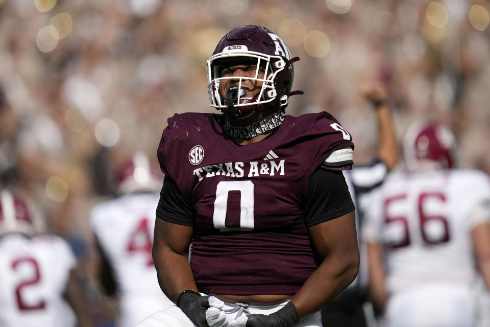 FILE - Texas A&M defensive lineman Walter Nolen (0) reacts after sacking Alabama quarterback Jalen Milroe (4) during the first half of an NCAA college football game Saturday, Oct. 7, 2023, in College Station, Texas. Nolen arrived at Mississippi from Texas A&M as one of the top-rated transfers and bolsters an experienced defensive front. The former five-star recruit started 14 games in two seasons with the Aggies and had four sacks last season. (AP Photo/Sam Craft, File)