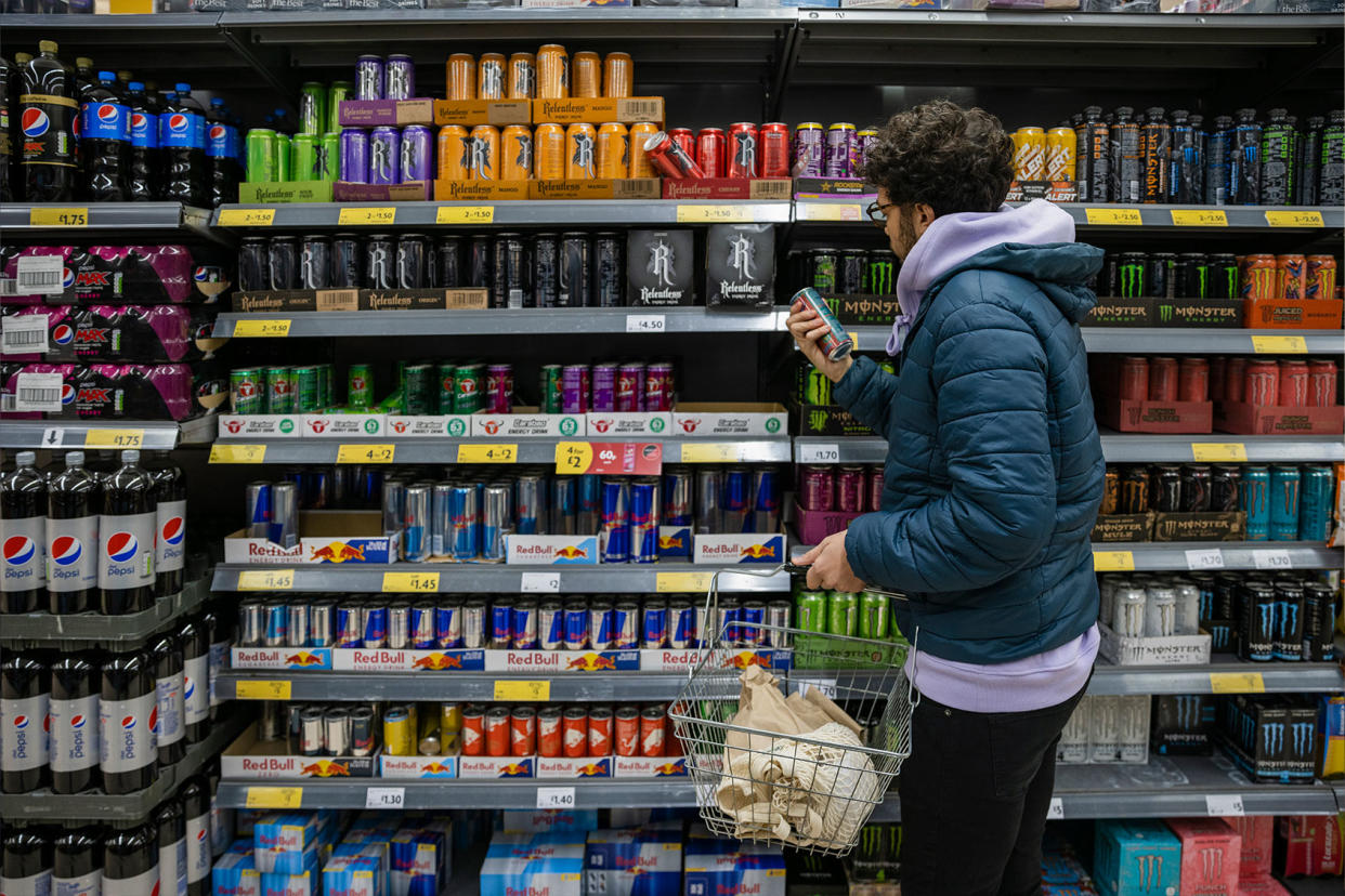 Man Shopping For Energy Drinks Getty Images/SolStock