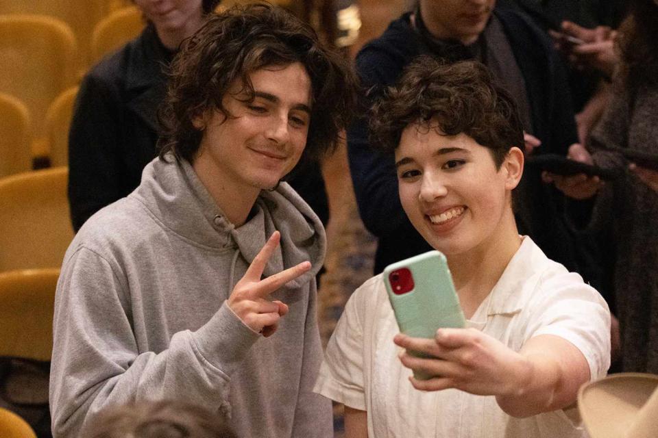 <p>Flom Designs and Photography</p> Timothée Chalamet poses for a photo with a high school student in Hibbing, Minnesota