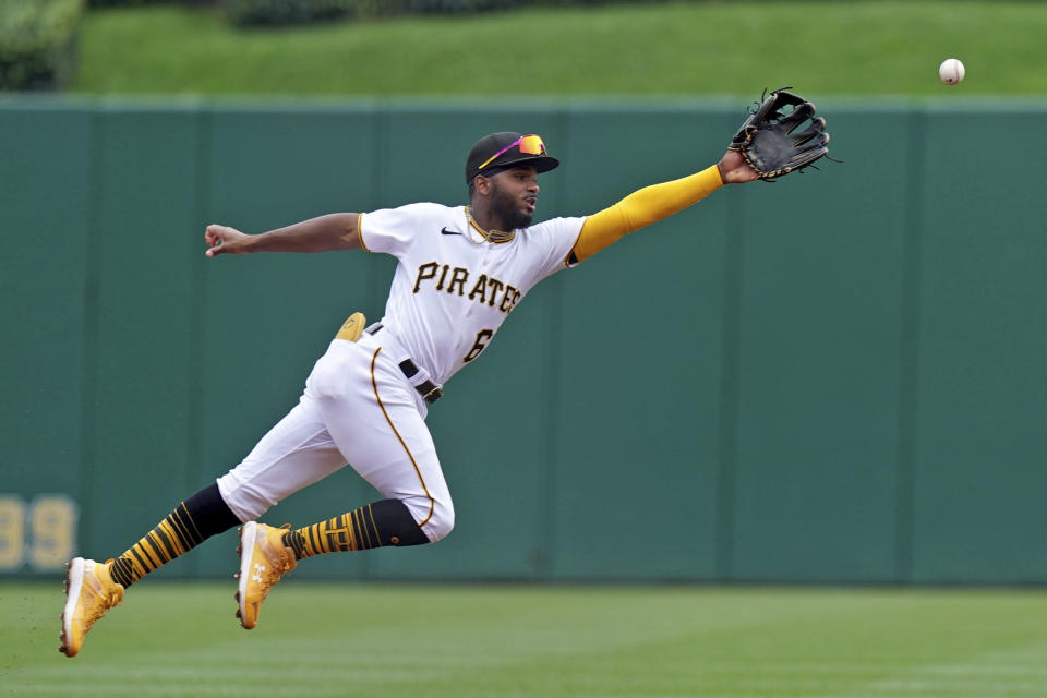 Pittsburgh Pirates second baseman Joshua Palacios reaches for an RBI single hit by St. Louis Cardinals' Paul Goldschmidt in the first inning of a baseball game in Pittsburgh, Wednesday, Aug. 23, 2023. (AP Photo/Matt Freed)