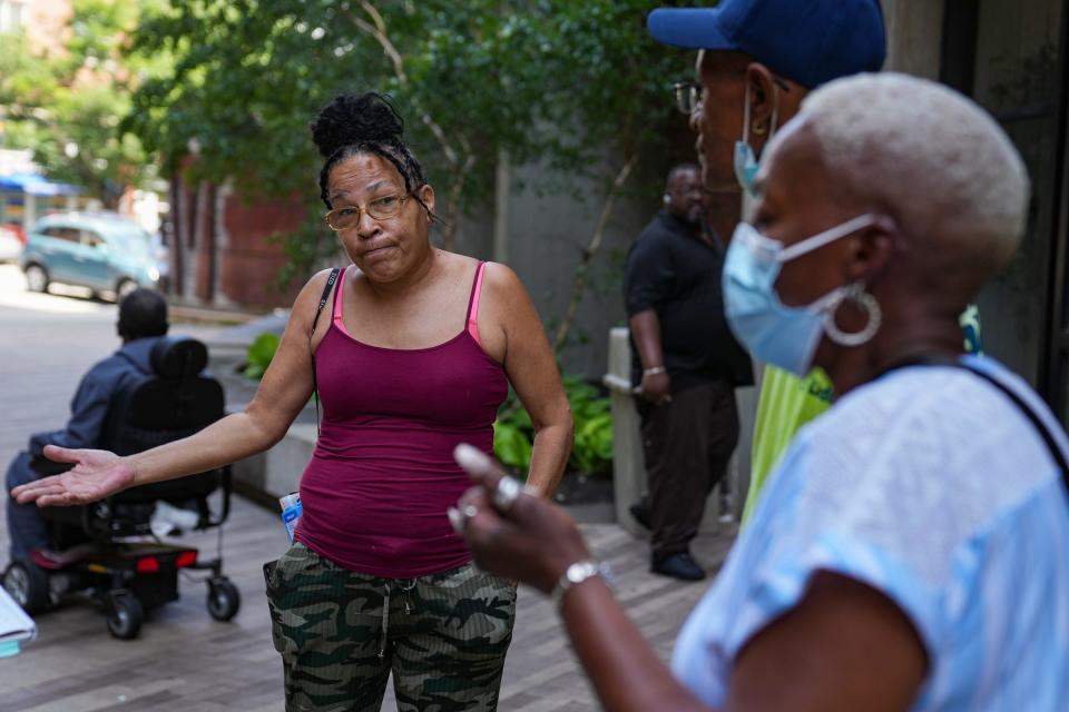 Nina Himes (left), vice president of the Barton Tower tenant association, talks to IndyStar on Tuesday, June 14, 2022, outside Barton Tower on Mass Ave in Indianapolis. Himes said there have been only about five days in the month of May and June when the air conditioning was working in her unit, and even then, it would sometimes shut off unexpectedly. 