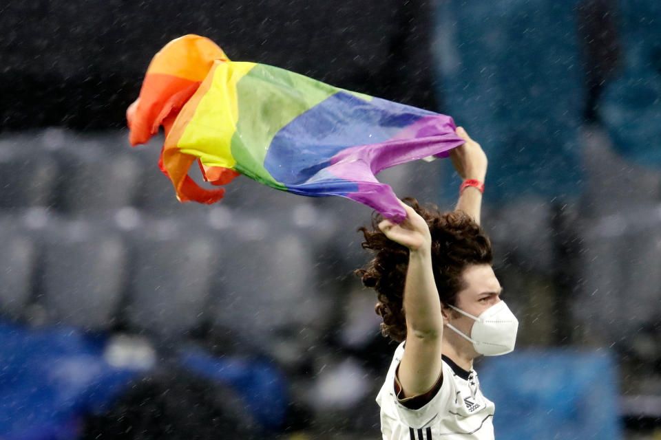 A Germany fan displays a rainbow flag before a Euro 2020 match against Hungary. (Photo by Laurens Lindhout/Soccrates/Getty Images)