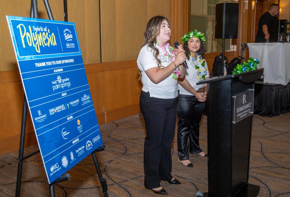 Hospitality management students Alejandra Portillo and Evyanah Camp provide opening remarks at the "Spirit of Polynesia" gala hosted by the CSUSB Palm Desert Campus on April 27, 2024.