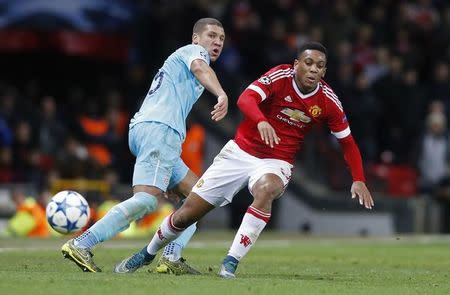 Football Soccer - Manchester United v PSV Eindhoven - UEFA Champions League Group Stage - Group B - Old Trafford, Manchester, England - 25/11/15 Manchester United's Anthony Martial and PSV's Jeffrey Bruma Action Images via Reuters / Carl Recine Livepic