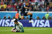 <p>Kylian Mbappe of France jumps clear of Thibaut Courtois of Belgium after he makes a save during the 2018 FIFA World Cup Russia Semi Final match between Belgium and France at Saint Petersburg Stadium on July 10, 2018 in Saint Petersburg, Russia. (Photo by Lars Baron – FIFA/FIFA via Getty Images) </p>