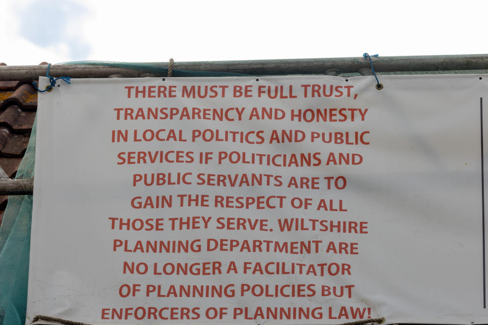 Michael Thomas previously erected a banner protesting against Wiltshire Planning Department. (SWNS)