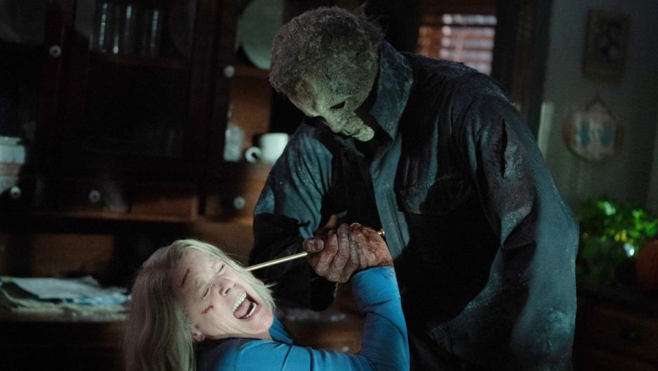 laurie strode struggles to keep Michael Myers from stabbing her in the head in halloween ends final trailer
