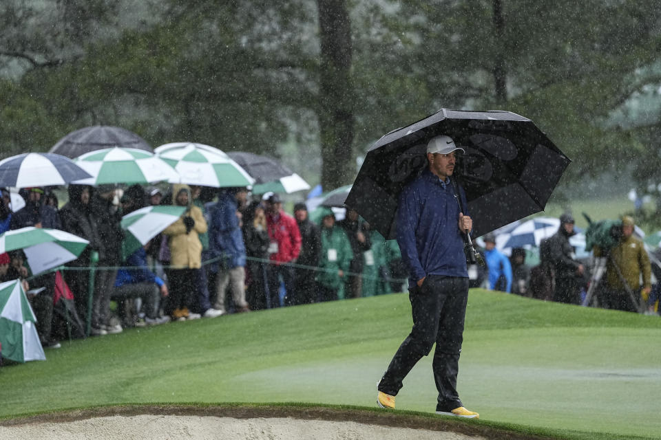 Brooks Koepka walks the near the green on the seventh hole during the weather delayed third round of the Masters golf tournament at Augusta National Golf Club on Saturday, April 8, 2023, in Augusta, Ga. (AP Photo/David J. Phillip)