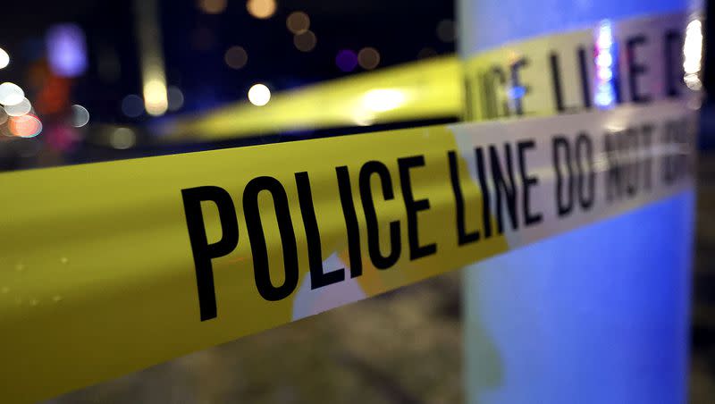 Police tape hangs at a scene in Salt Lake City on Monday, March 15, 2021. Two 19-year-old men have been arrested in connection with a DUI crash in downtown Salt Lake City that left one person critically injured.