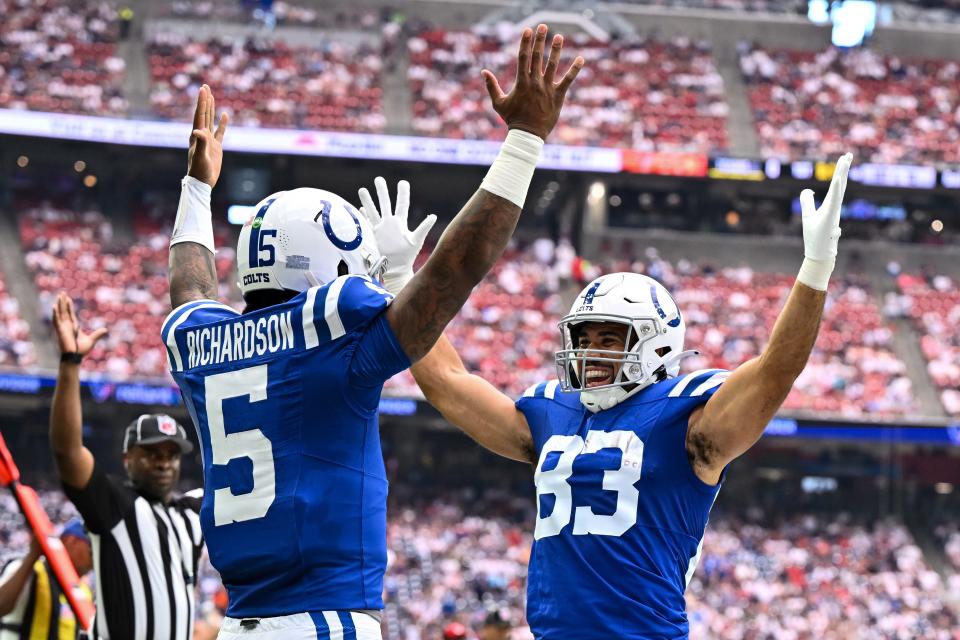 Sep 17, 2023; Houston, Texas, USA; Indianapolis Colts quarterback Anthony Richardson (5) celebrates his touchdown with tight end Kylen Granson (83) against the Houston Texans during the first quarter at NRG Stadium.