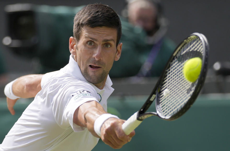 FILE - Serbia's Novak Djokovic plays a return to Italy's Matteo Berrettini during the men's singles final on day thirteen of the Wimbledon Tennis Championships in London, in this Sunday, July 11, 2021, file photo. Djokovic is seeded for the U.S. Open, the year's last Grand Slam tennis tournament. Play in the main draw begins in New York on Monday, Aug. 30. (AP Photo/Kirsty Wigglesworth, FIle)