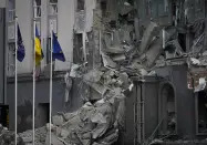 A damaged hotel at the scene of Russian shelling in Kyiv, Ukraine, Saturday, Dec. 31, 2022. (AP Photo/Efrem Lukatsky)