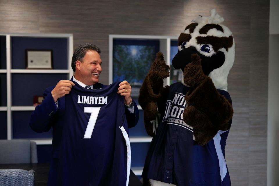 New President Moez Limayem is surprised with a jersey from Ozzie the Osprey as he speaks to media members at the UNF President's Office Monday, Aug. 1, 2022 in Jacksonville.