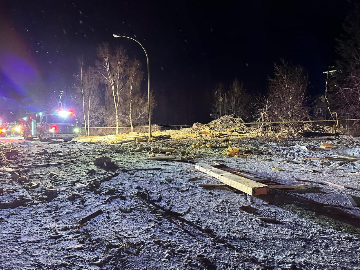 Emergency crews were called to a house explosion in Whitehorse's Riverdale neighbourhood on Tuesday. The blast happened at about 5:30 a.m. on Bates Crescent. (Jackie Hong/CBC News) (Jackie Hong/CBC - image credit)