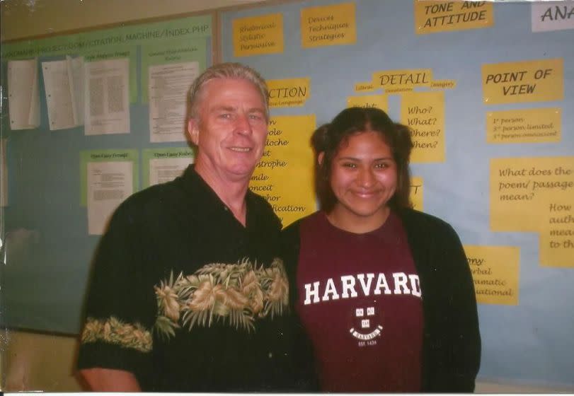 Santa Ana High School English teacher Bill Roberts stands next to his student Gloria Montiel, the first believed to attend Harvard University from that high school.