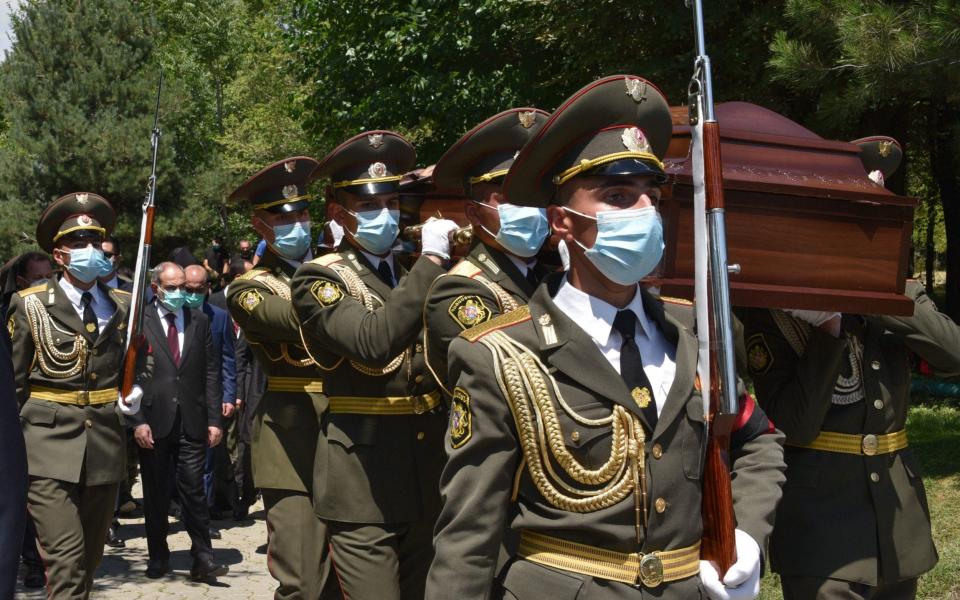 Armenian servicemen carry the coffin of Major Garush Hambardzumyan, who was killed during armed clashes on the Armenian-Azerbaijani border -  KAREN MINASYAN/AFP