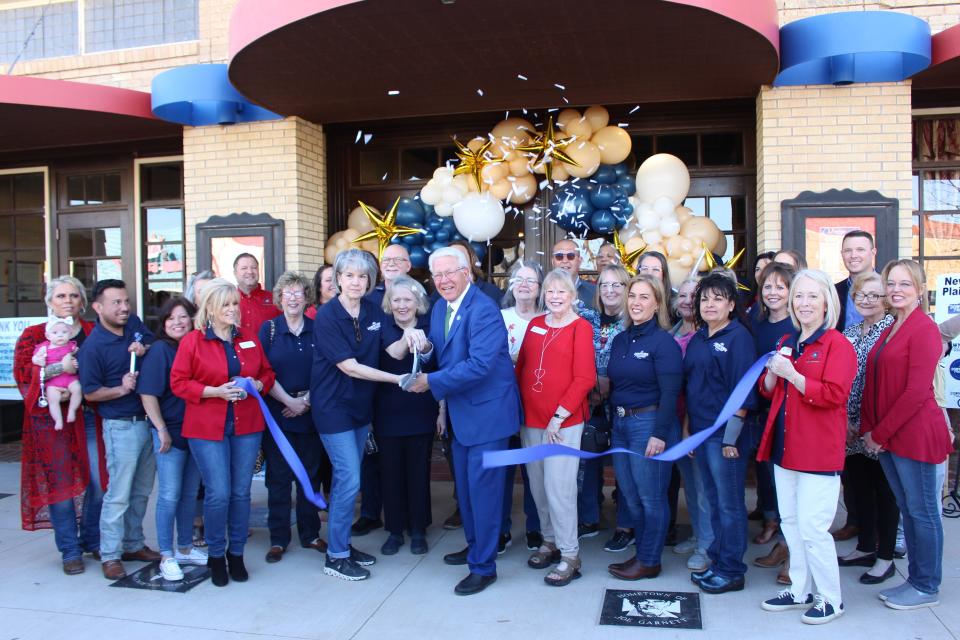 Downtown Plainview president Ranada Jack and Plainview mayor Charles Starnes, surrounded by Downtown Plainview members, Chamber of Commerce ambassadors and City Council members, cut the ribbon on a revitalized downtown Plainview at the Downtown Plainview Streetscape Celebration on Friday, April 8, 2022.
