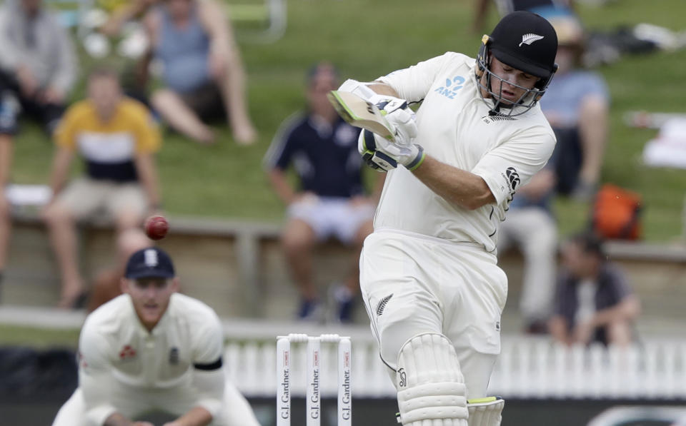 New Zealand's Tom Latham hits the ball for four runs during play on day one of the second cricket test between England and New Zealand at Seddon Park in Hamilton, New Zealand, Friday, Nov. 29, 2019. (AP Photo/Mark Baker)