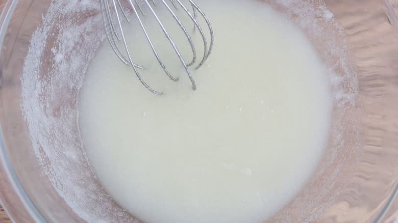 white liquid in clear bowl