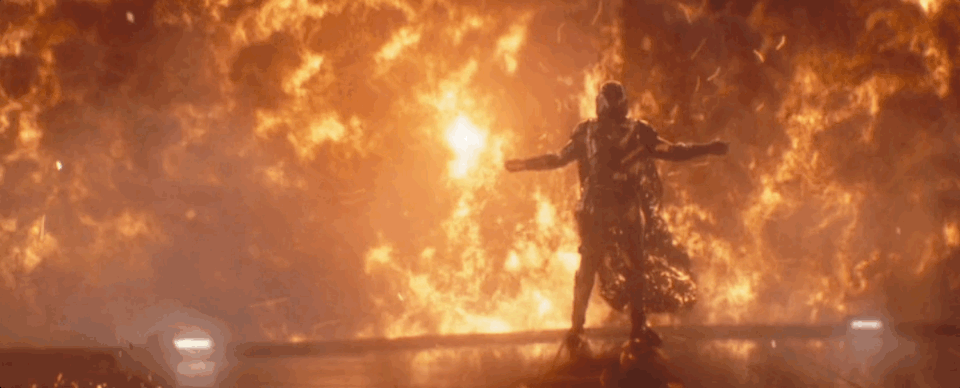 A gif of Moff Gideon holding out his arms as fire engulfs him on The Mandalorian