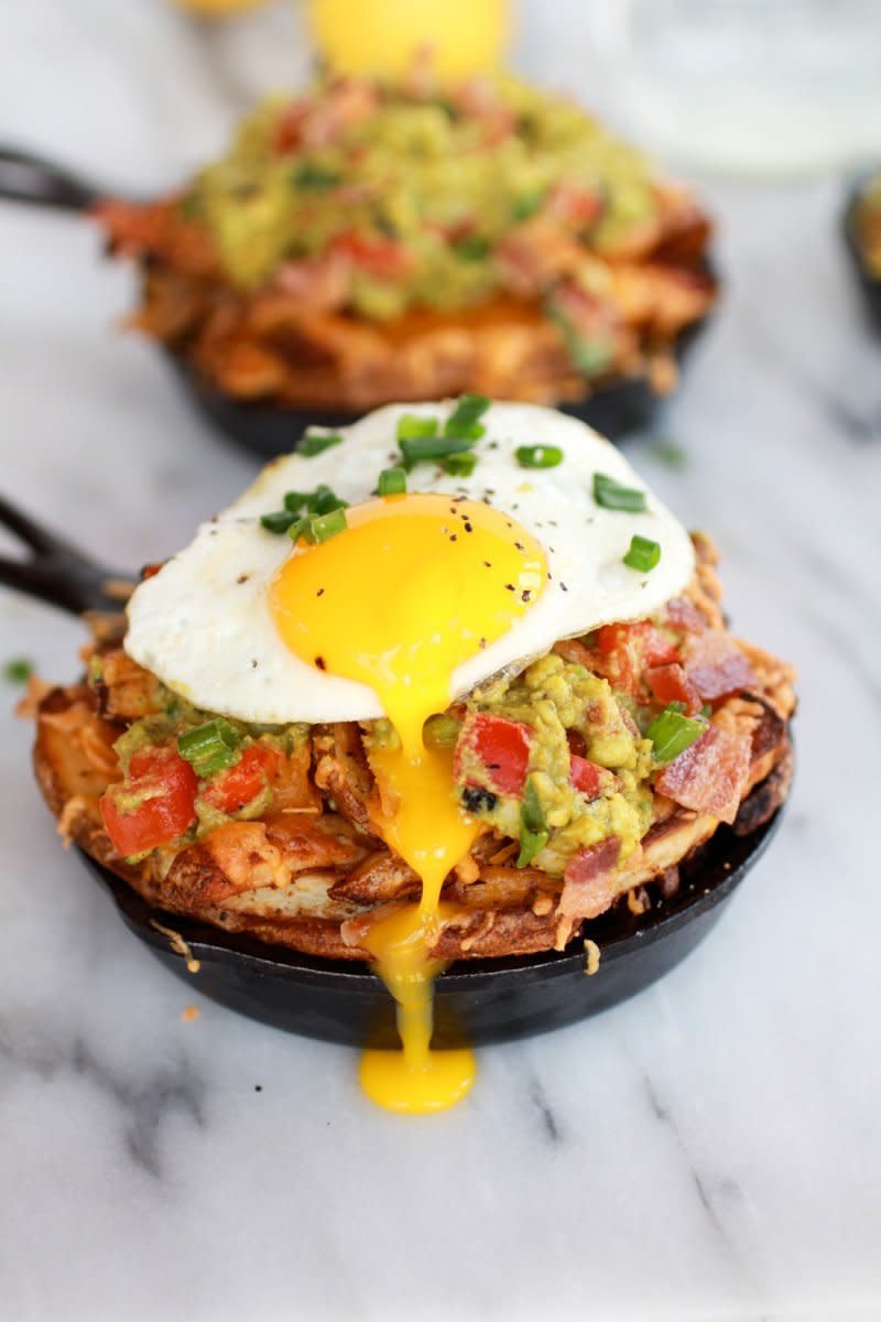 <strong>Get the <a href="http://www.halfbakedharvest.com/cheesy-cajun-fries-with-grilled-corn-guacamole-bacon-and-fried-eggs/" target="_blank">Cheesy Cajun Fries with Grilled Corn Guacamole, Bacon and Fried Eggs recipe</a> from Half Baked Harvest</strong>