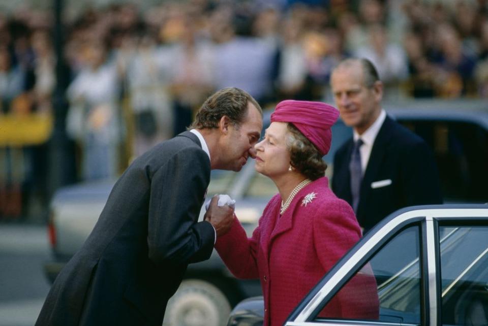 King Juan Carlos pictured with the late Queen Elizabeth II