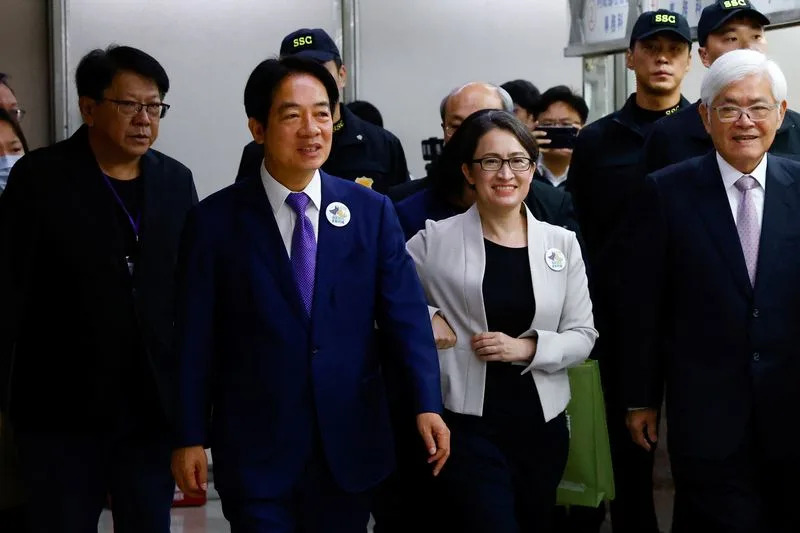 Taiwan's Vice President Lai Ching-te and his running mate Hsiao Bi-Khim arrive to register for the upcoming presidential election, in Taipei