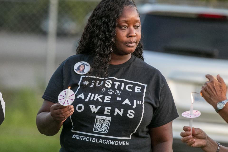 Tocara Davis and other mourners participate in the candlelight vigil during the "Ajike "AJ" Owens: Mourning a Mother and Others Taken by Gun Violence" vigil at GNV Bridge Community Center in Gainesville, Florida on Wednesday, Aug. 2, 2023. Community groups gathered together for a vigil and call to action for the Ocala mother. Owens was fatally shot by her neighbor Susan Lorincz in June when she went to her door. Lorincz was arrested on June 6 and charged in the shooting. The event is hosted by GNV Bridge, Greater Duval Neighborhood Association, Moms Demand Action for Gun Sense, the Alachua County branch of the NAACP, M.A.M.A.'s Club, Beyond Grieving LLC, and the Against All Odds Movement.