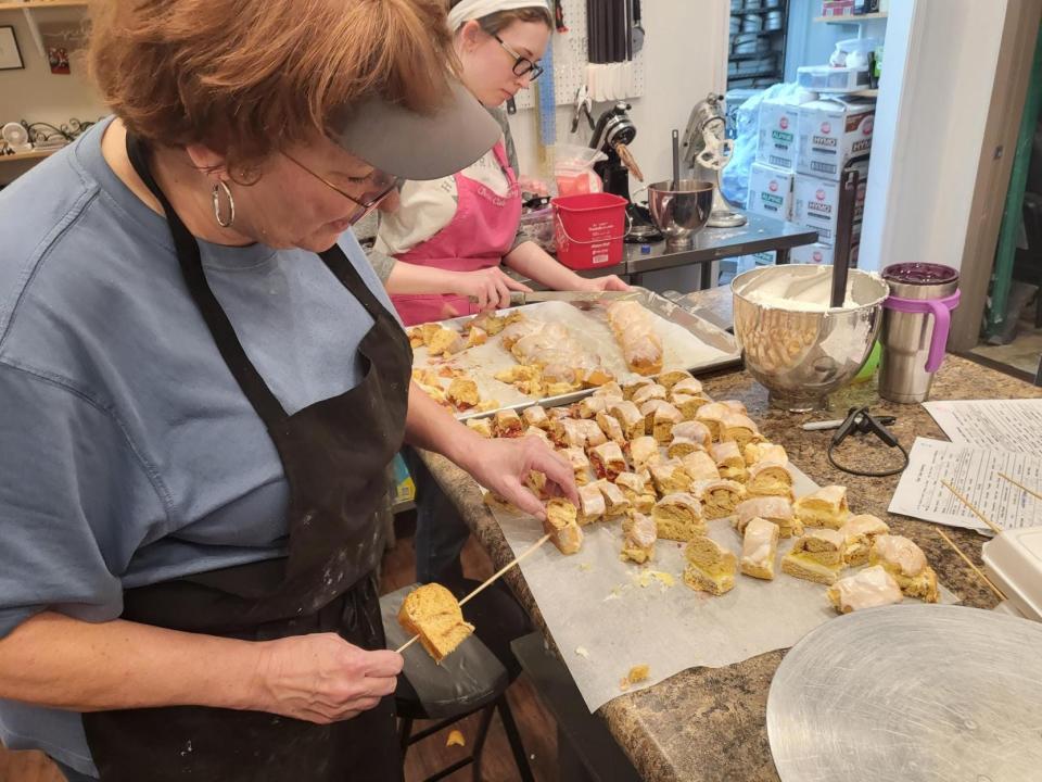 Sarah Foret creates king cake kebabs at the Chez Bakery 1297 St. Charles St., Houma, Jan. 19.