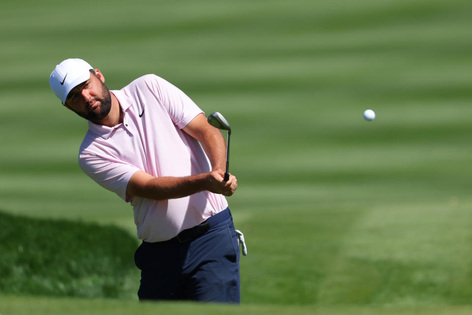 PONTE VEDRA BEACH, FLORIDA - MARCH 12:  Scottie Scheffler of the United States plays a shot on the 14th hole during a practice round prior to THE PLAYERS Championship on the Stadium Course at TPC Sawgrass on March 12, 2024 in Ponte Vedra Beach, Florida. (Photo by Kevin C. Cox/Getty Images)