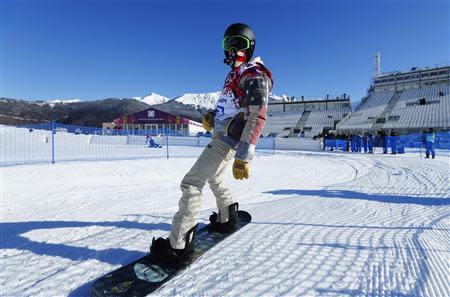 U.S. snowboarder White cruises out of the finish area during snowboard slopestyle training at the 2014 Sochi Winter Olympics in Rosa Khutor