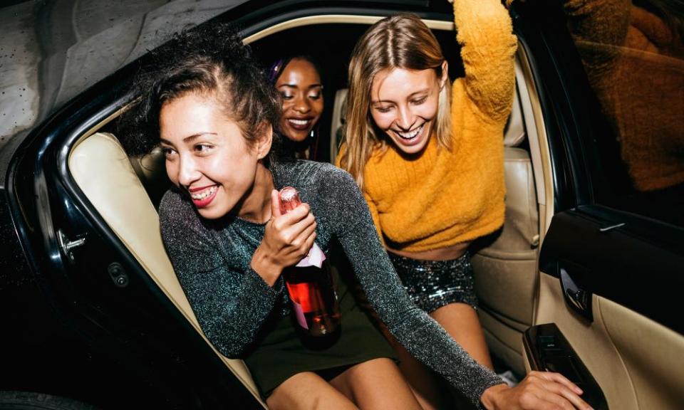 Diverse women in a backseat of a cab