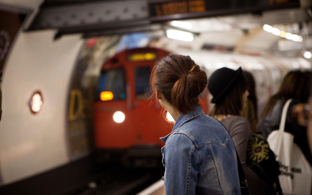 People waiting on London underground platform - justintanwy