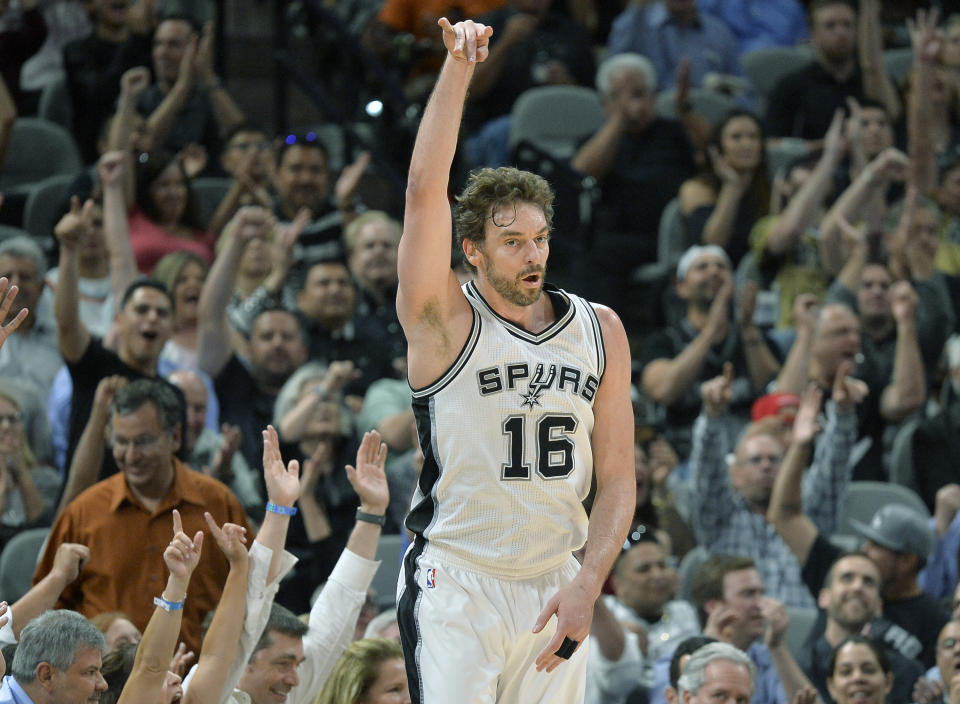 San Antonio Spurs center Pau Gasol, of Spain, celebrates a 3-point basket during the first half of an NBA basketball game against the Cleveland Cavaliers, Monday, March 27, 2017, in San Antonio. (AP Photo/Darren Abate)