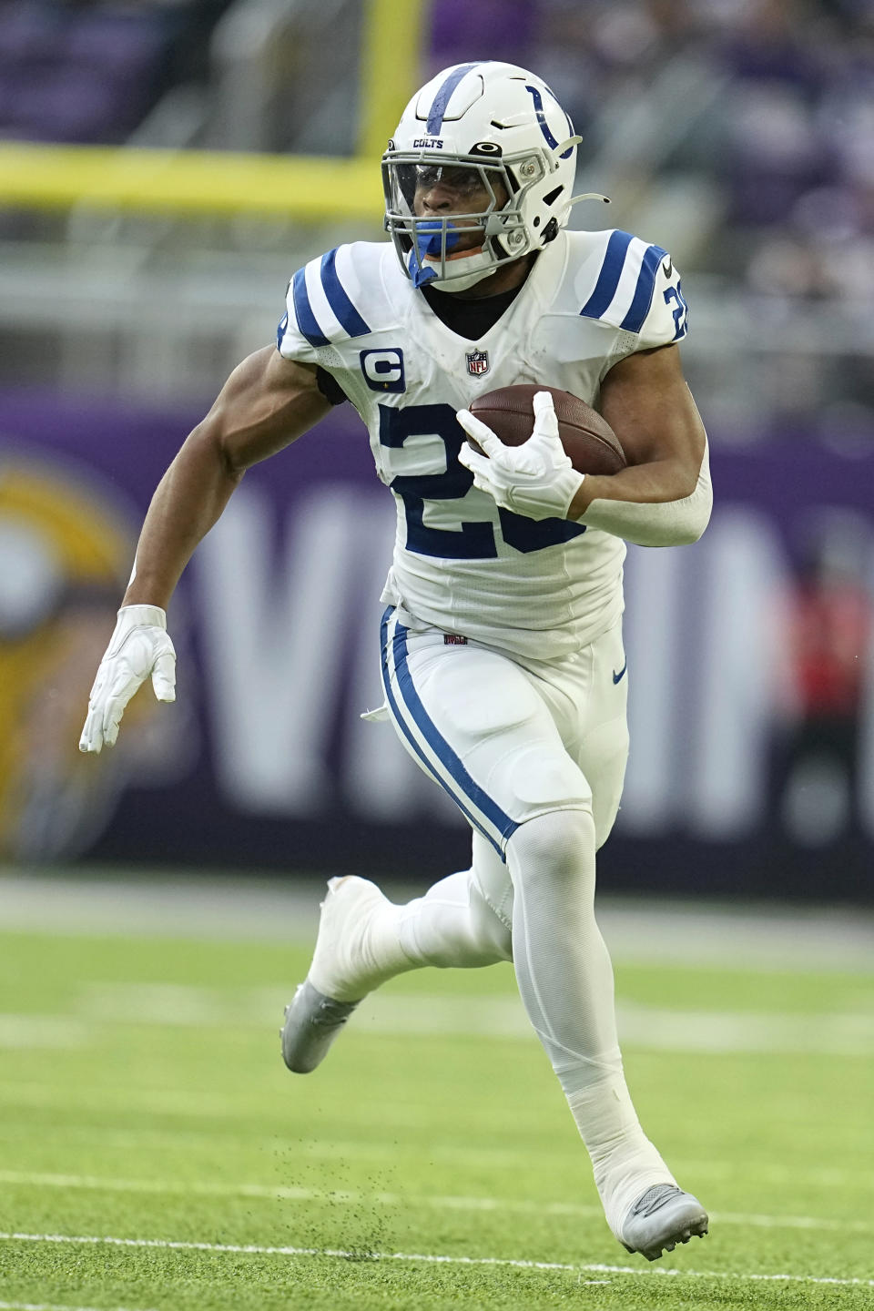 Indianapolis Colts running back Jonathan Taylor carries the ball up field during the first half of an NFL football game against the Minnesota Vikings, Saturday, Dec. 17, 2022, in Minneapolis. (AP Photo/Abbie Parr)