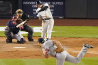 Atlanta Braves starting pitcher Charlie Morton, right, follows through as New York Yankees Gio Urshela hits a solo home run during the fifth inning of an interleague baseball game, Tuesday, April 20, 2021, at Yankee Stadium in New York. Braves catcher Travis d'Arnaud and home plate umpire Laz Diaz watch the play. (AP Photo/Kathy Willens)