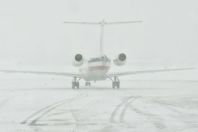 <p>Daniel Acker/Bloomberg via Getty Images</p> An American Eagle regional jet taxis on a snow covered tarmac outside the Central Terminal at LaGuardia Airport in Queens, New York, U.S., on Wednesday, Feb. 10, 2010