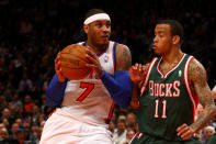 Carmelo Anthony (7) drives in the second half against Monta Ellis of the Milwaukee Bucks at Madison Square Garden on March 26, 2012 in New York. (Photo by Chris Chambers/Getty Images)
