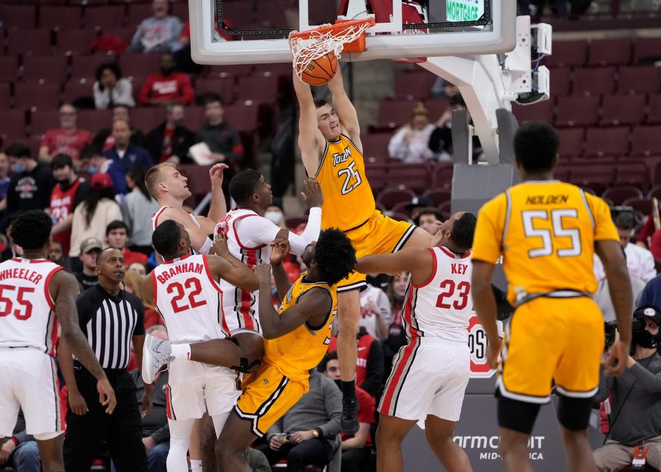 Then with Towson, Nicolas Timberlake (25) dunks over Ohio State's Zed Key (23) during a Dec. 8, 2021 game at Value City Arena in Columbus.